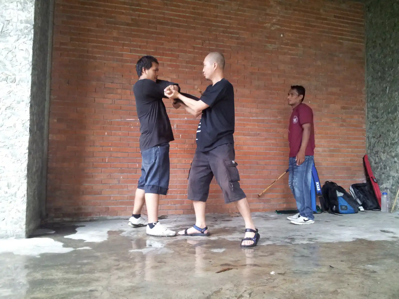 Early UP days rainy day training. With my brother Emil, supervised by Master Nonoy Doncillo. Circa 2012.